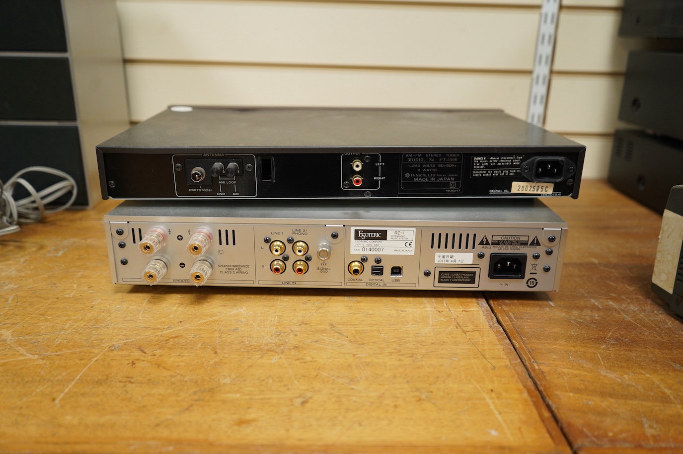 An Esoteric RZ-1 Integrated Music System, amplifier SACD/CD player, together with a Hitachi FT-5500 AM/FM stereo tuner, plus cables.